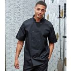 Model wearing Premier Unisex Short Sleeve Stud Front Chefs Jacket