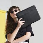Bagbase Essential 13" Laptop Case in Black being held to show size