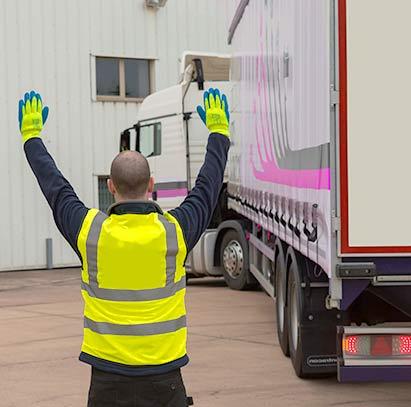 Image shows man wearing a Hi Vis west on a construction site